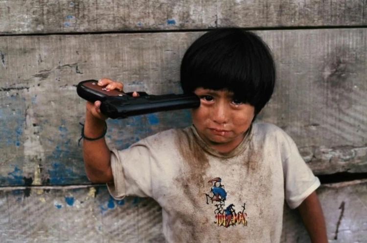 Young Boy With A Gun To His Head